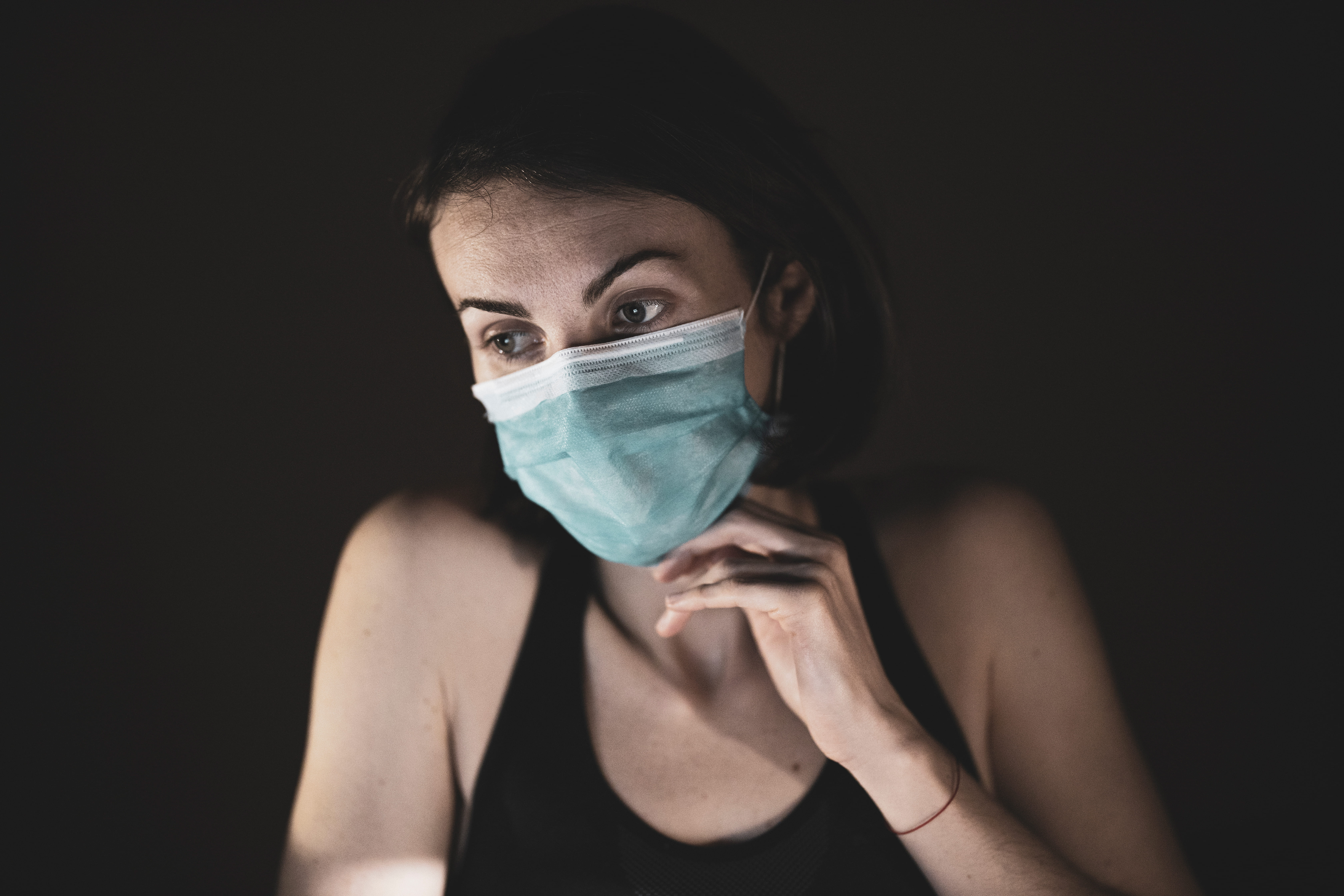 Canva - Woman in Black Tank Top Covering Her Face With Blue and White Mask 1jpg