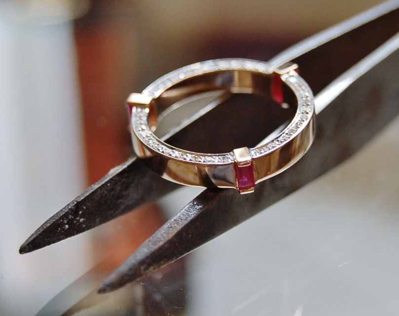 Red gold, baguette rubies and white diamond rails