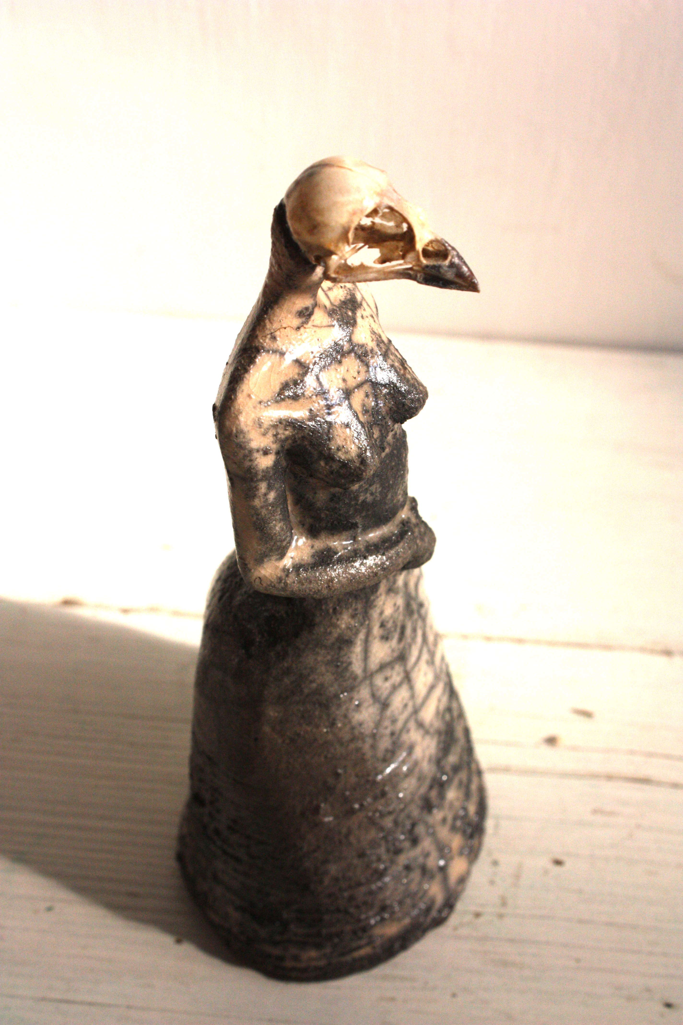 Raku ceramic and bird skull