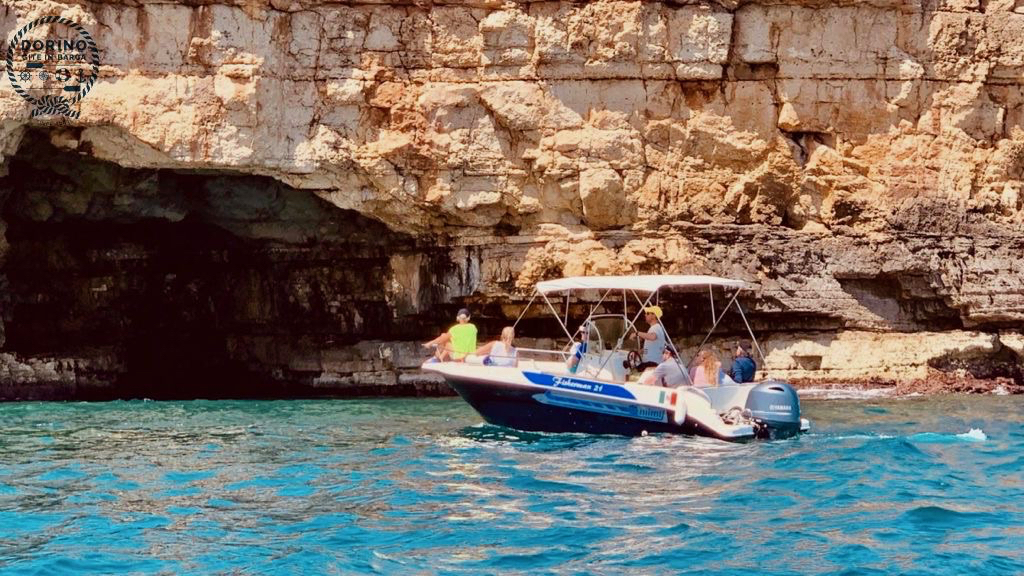 The young captain of the crew Dorino Gite in Barca proudly shows the beauties of Polignano