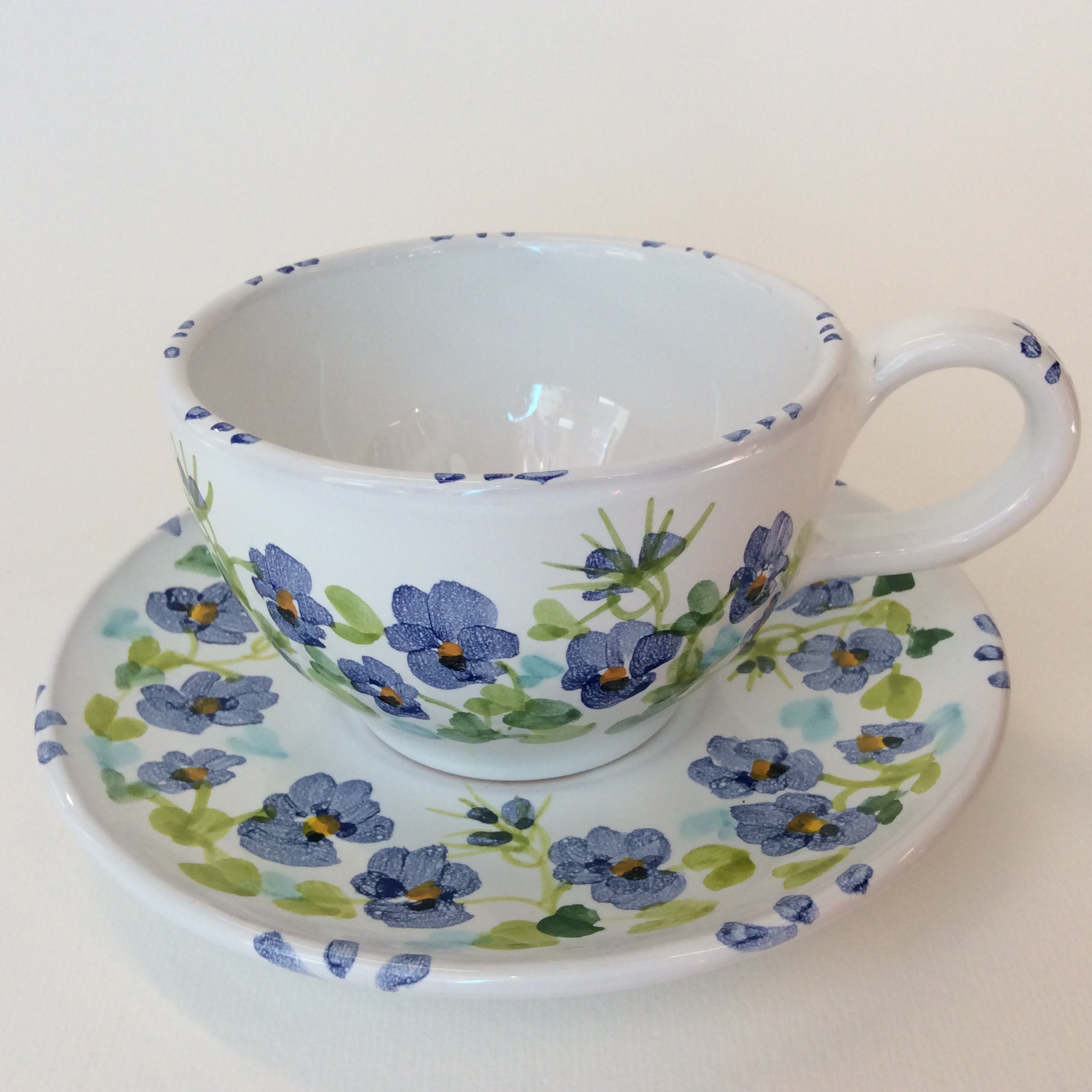 two tea cup plate violets