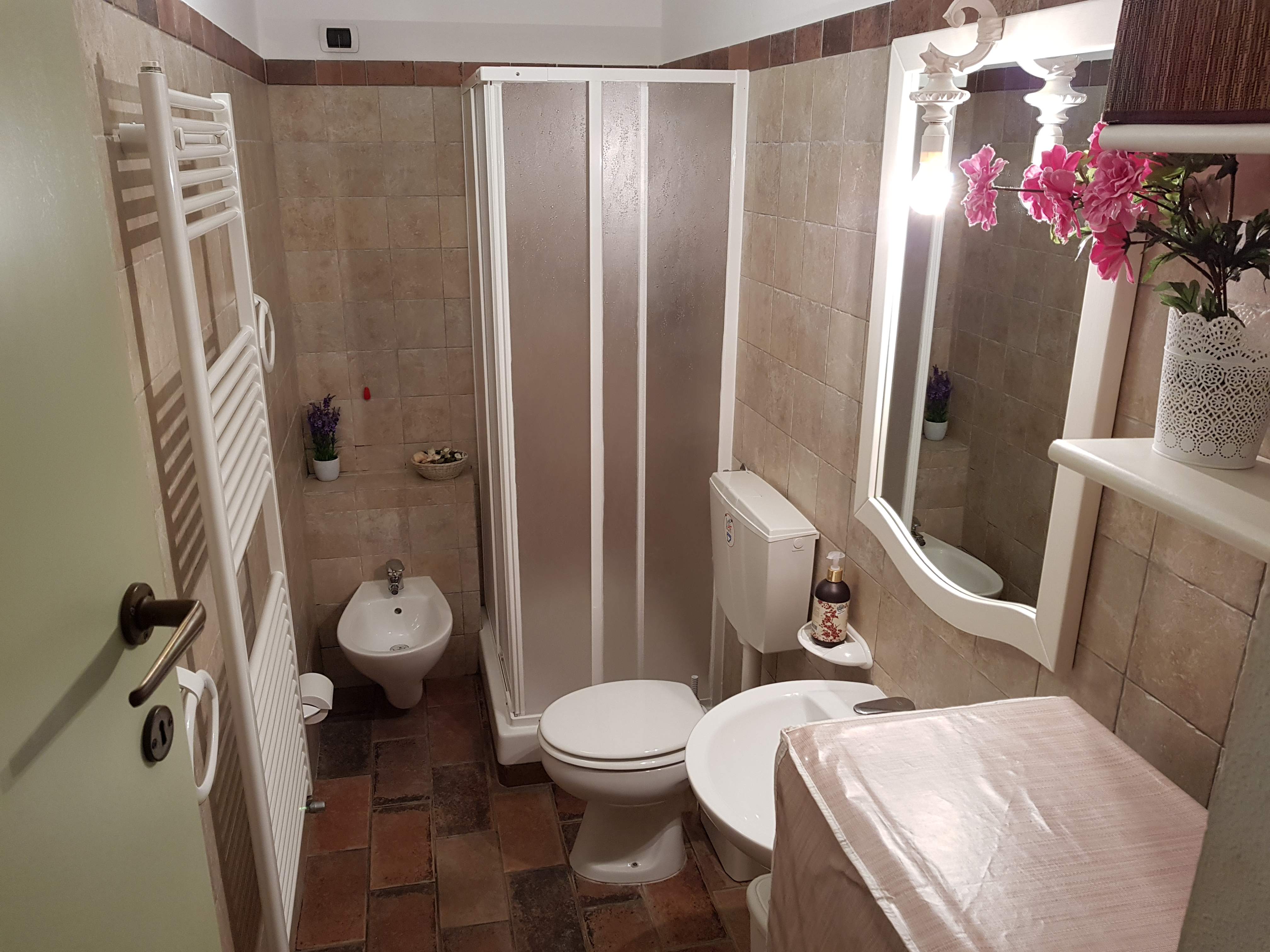 bathroom with shower and washing machine farmhouse San Gimignano